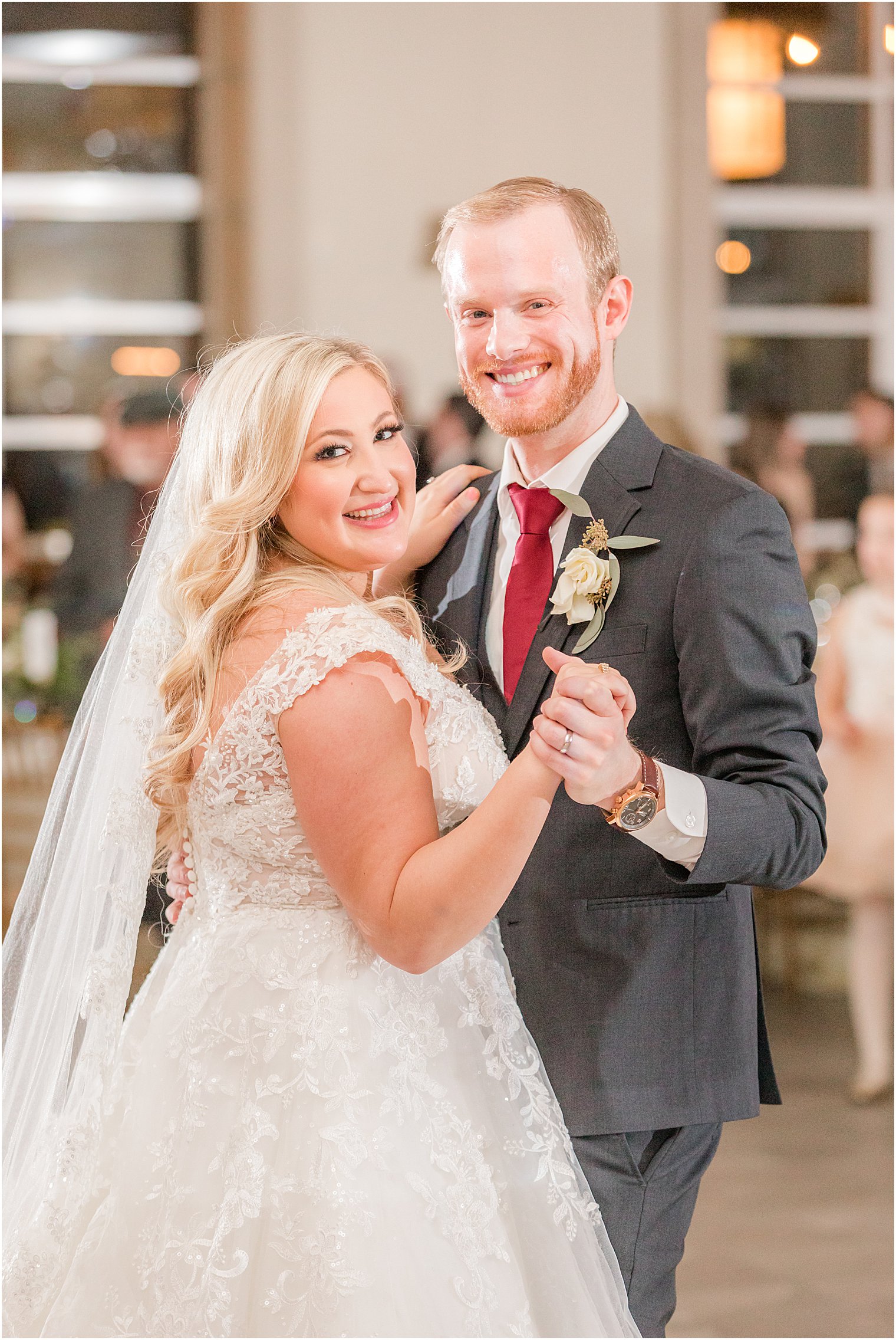 bride and groom dance together during reception in New Jersey