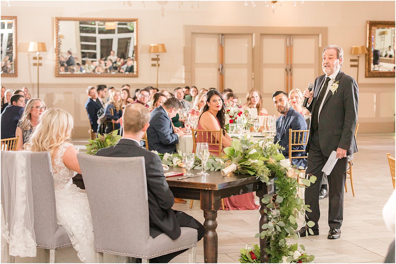 father gives speech during wedding reception 