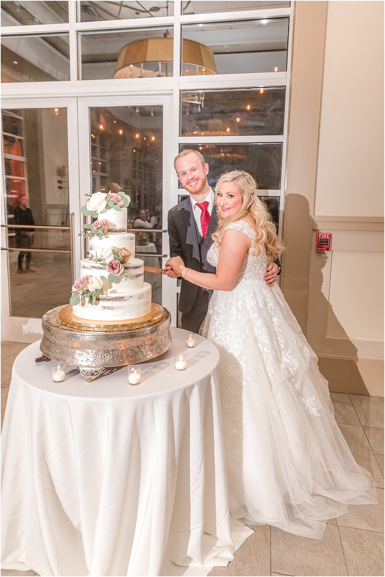 bride and groom cut tiered wedding cake in Warren NJ