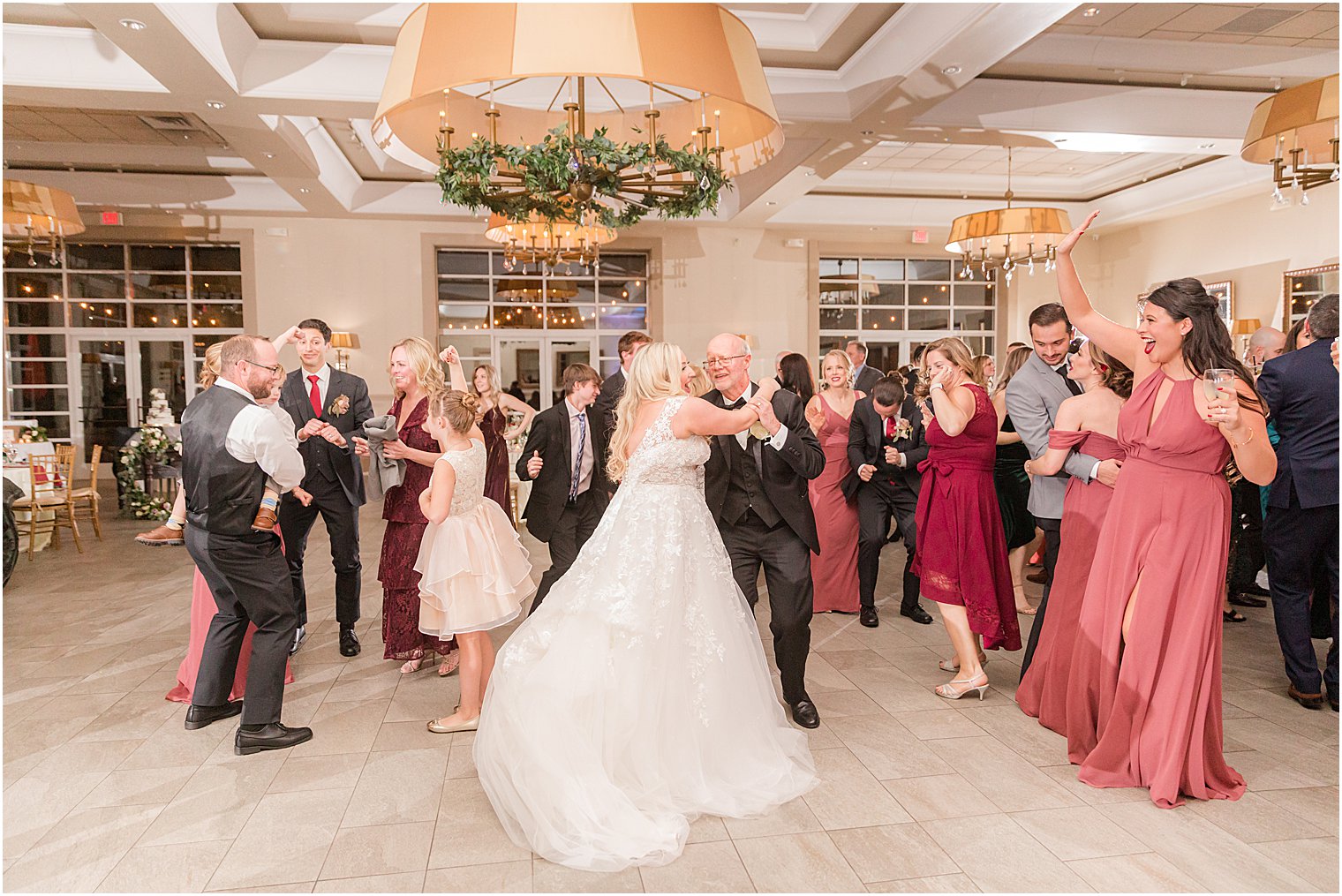 newlyweds dances with guests during Warren NJ wedding reception