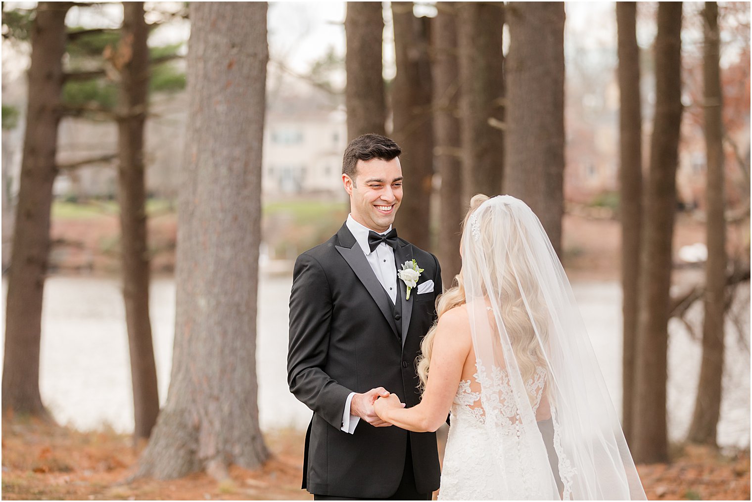 groom laughs at bride during first look in New Jersey 