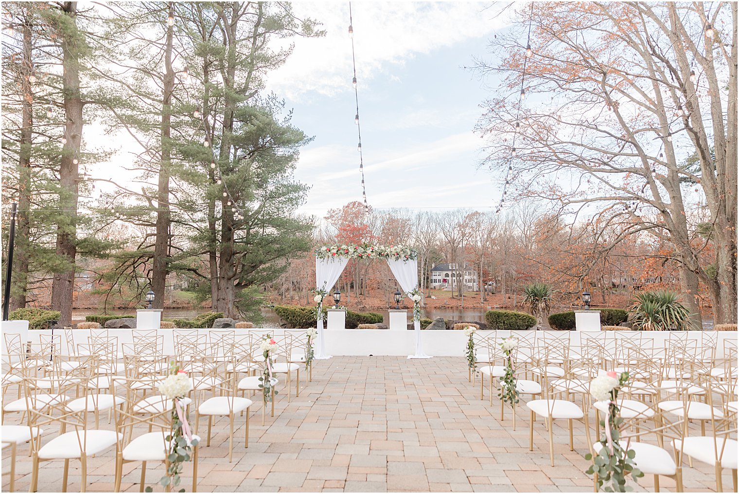 ceremony site with gold chivari chairs for outdoor wedding ceremony in East Brunswick NJ