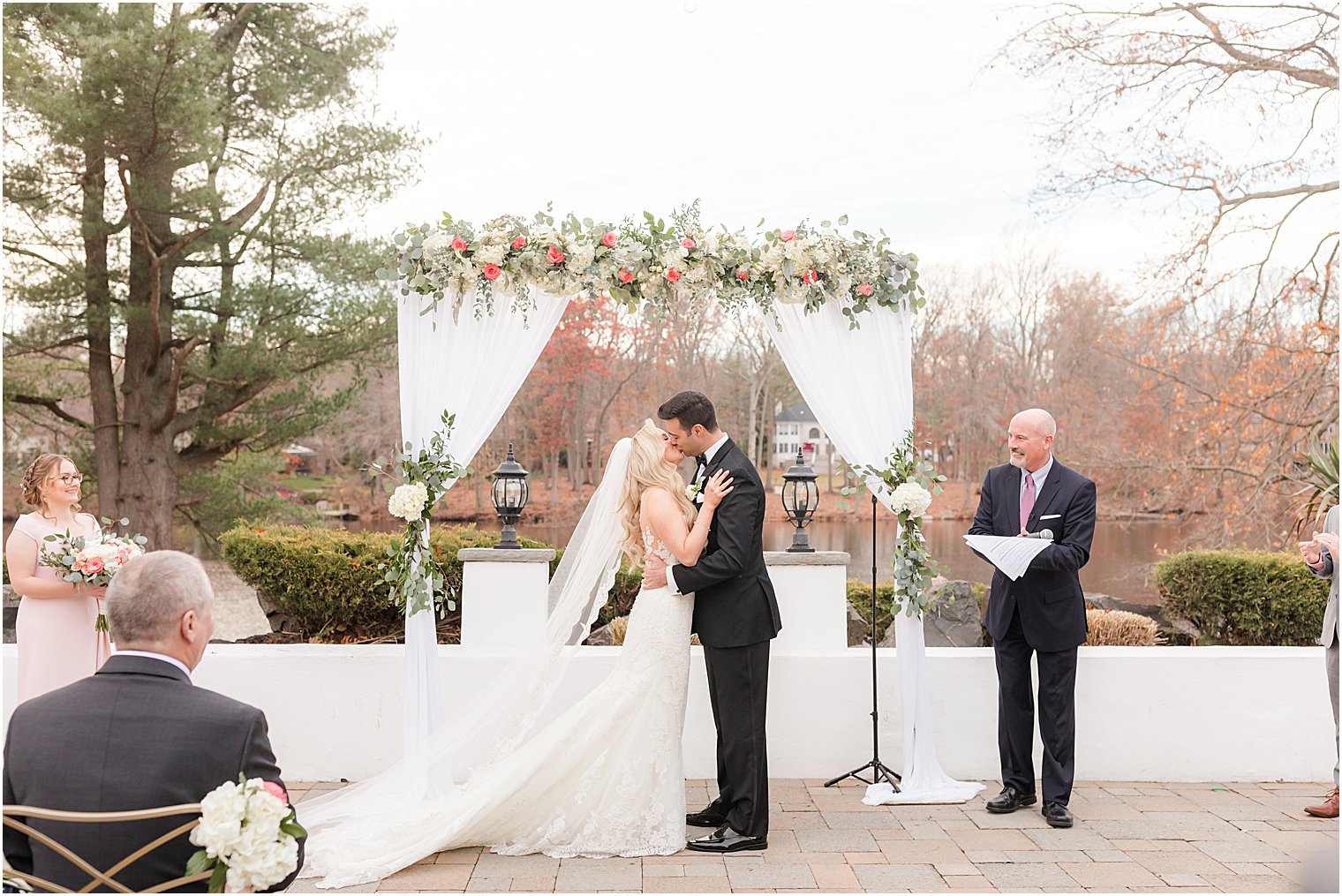bride and groom kiss during outdoor wedding ceremony in East Brunswick NJ