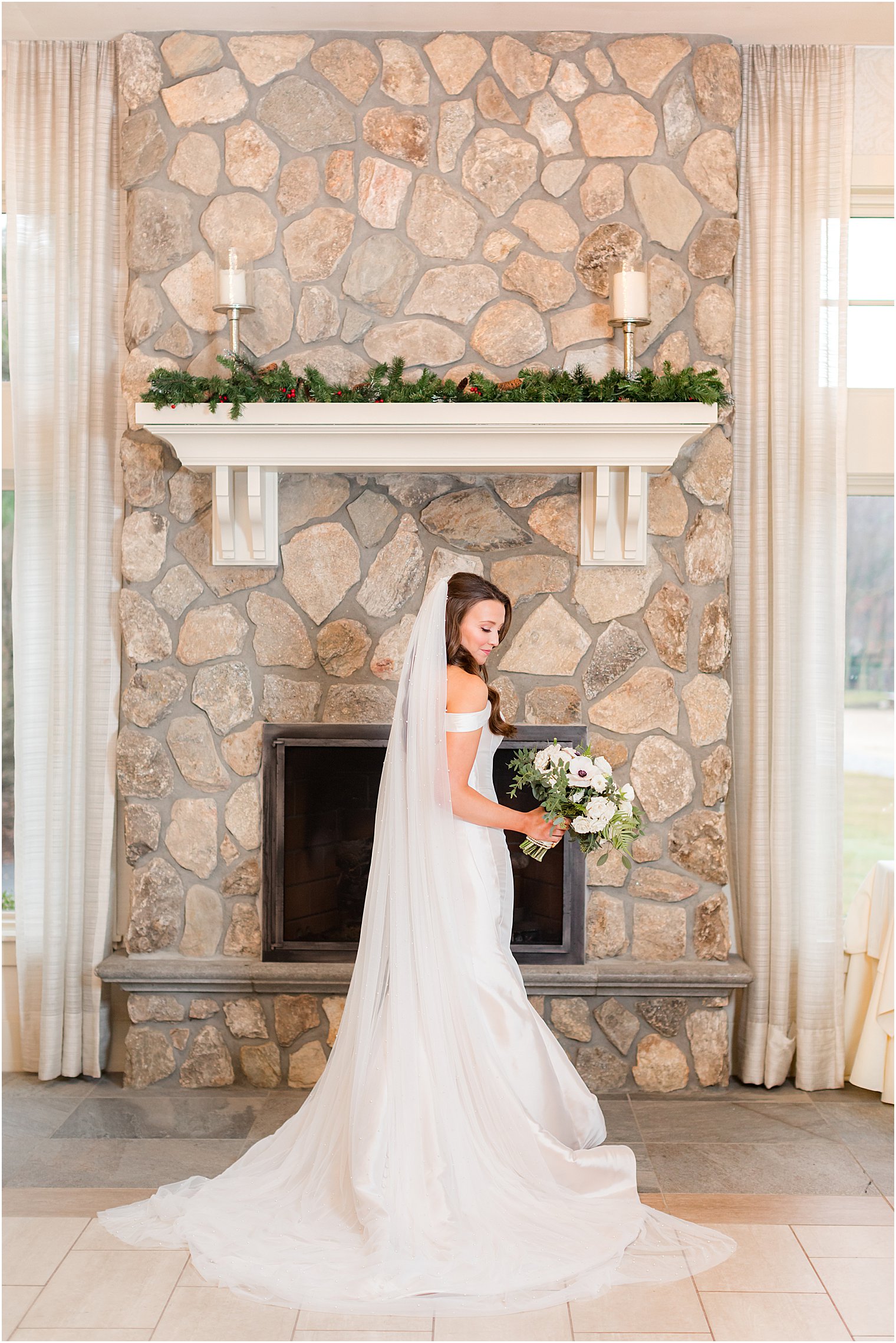 bridal portrait by stone fireplace at Indian Trail Club