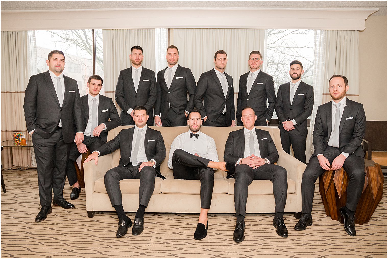 groom and groomsmen sit on couch at Indian Trail Club