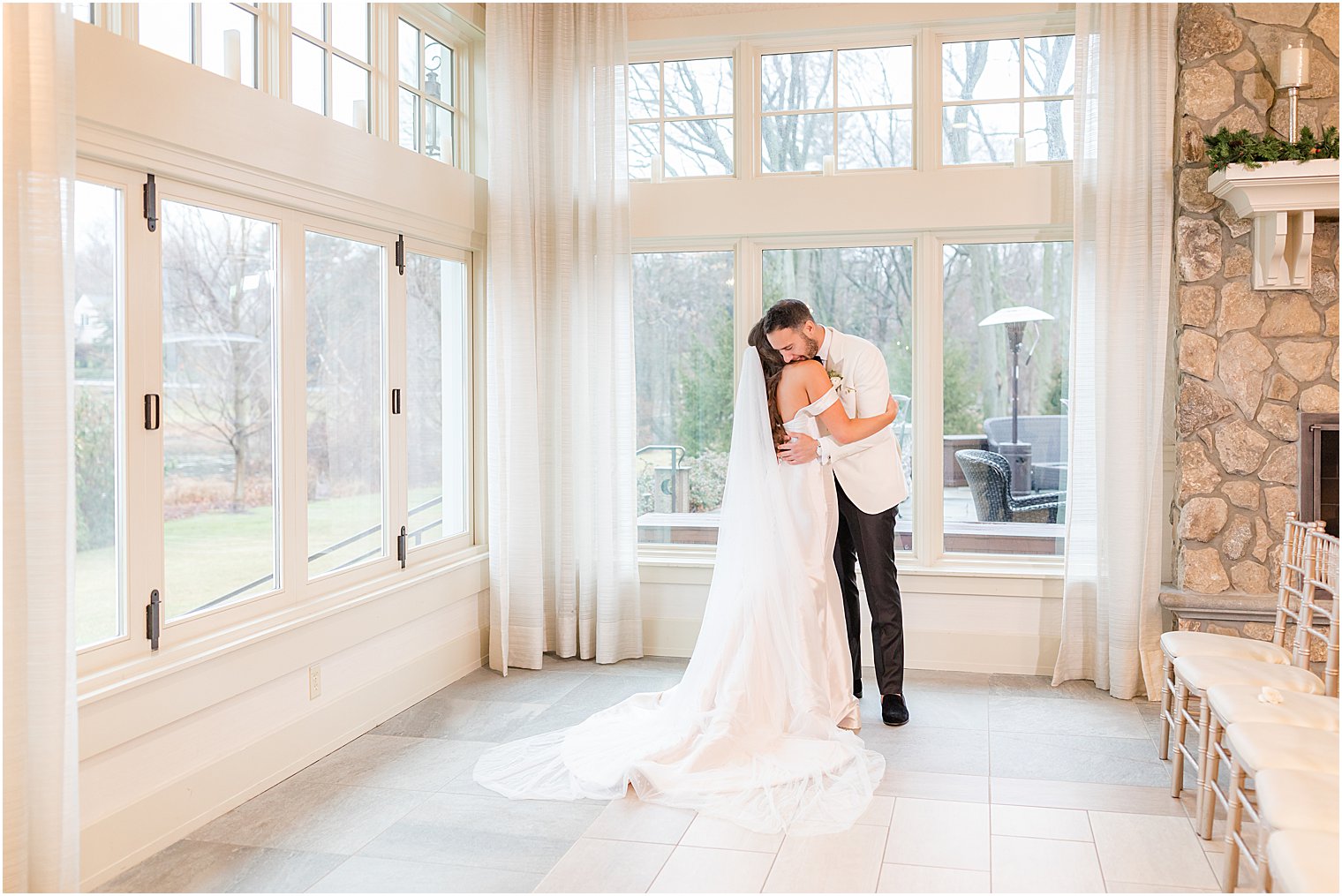 bride and groom hug during first look in New Jersey