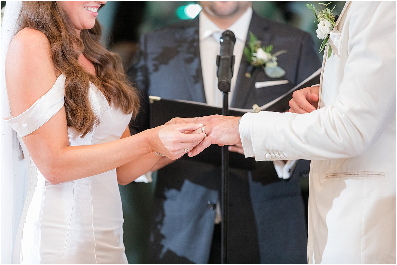 bride and groom exchange rings during Jewish wedding ceremony in Franklin Lakes NJ