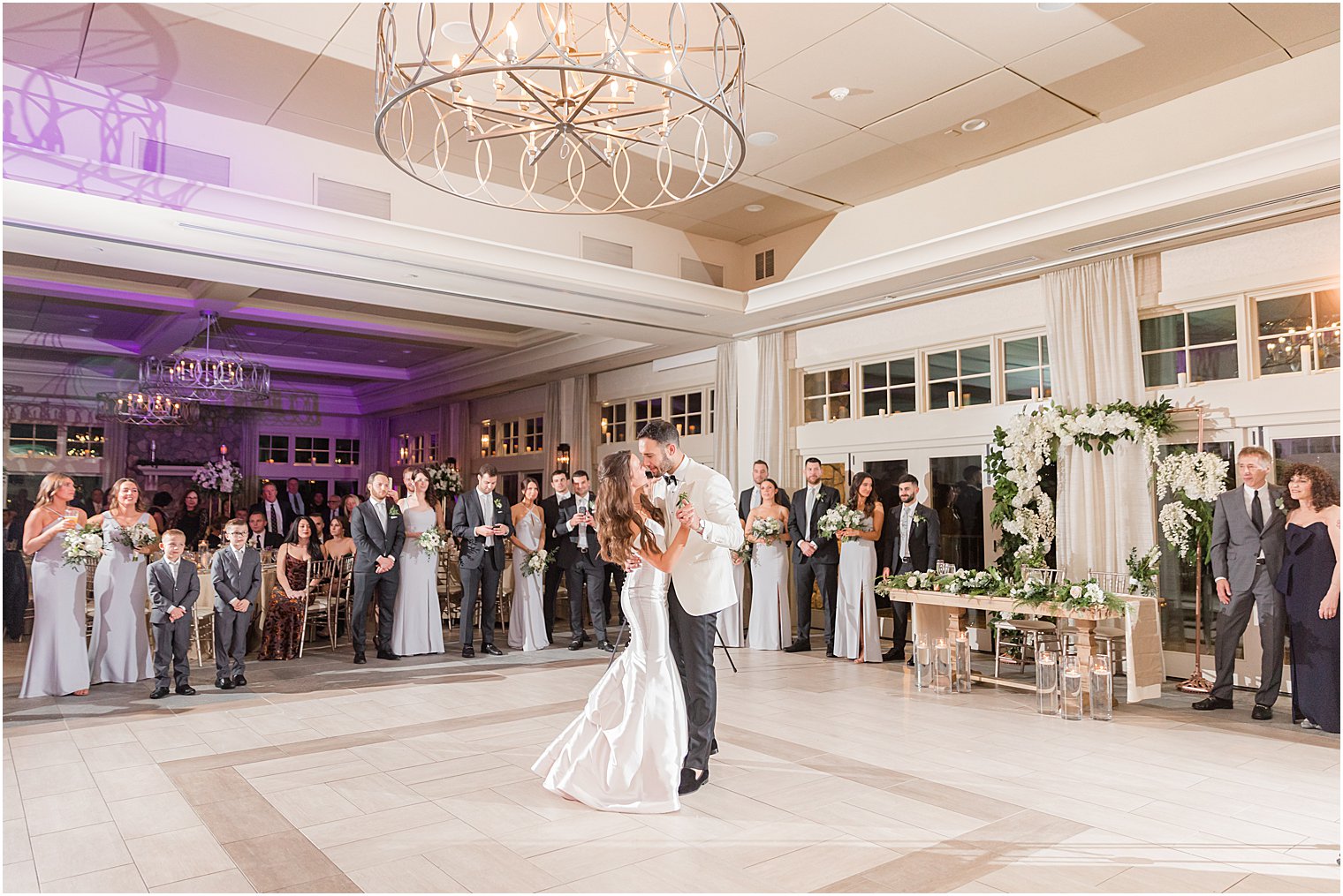 bride and groom have first dance at winter wedding reception
