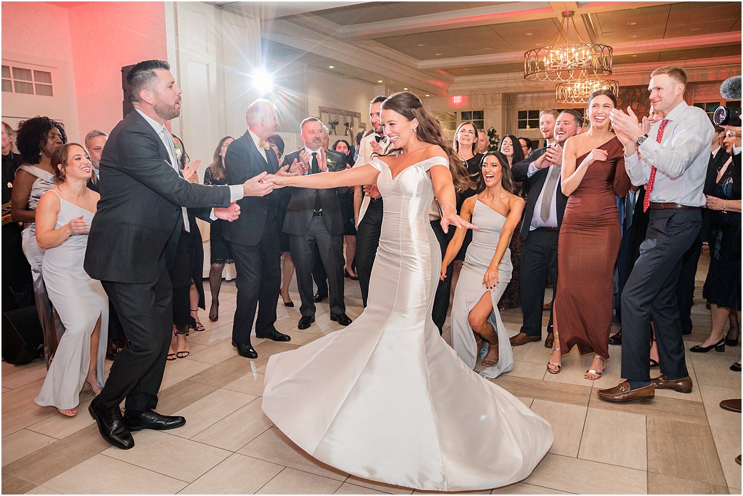 guest dances with bride during Franklin Lakes NJ wedding reception
