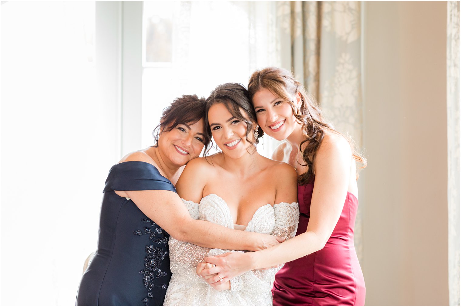 bridesmaid and mom hug bride before NJ wedding day