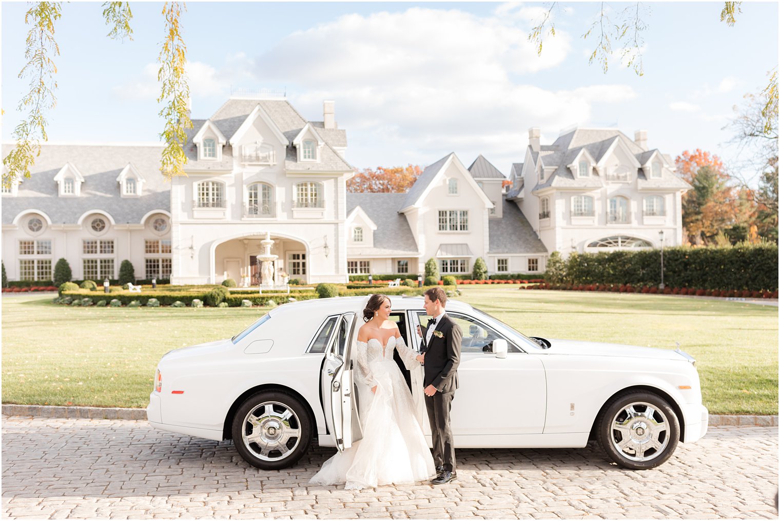 bride and groom arrive at Park Chateau Estate in white car