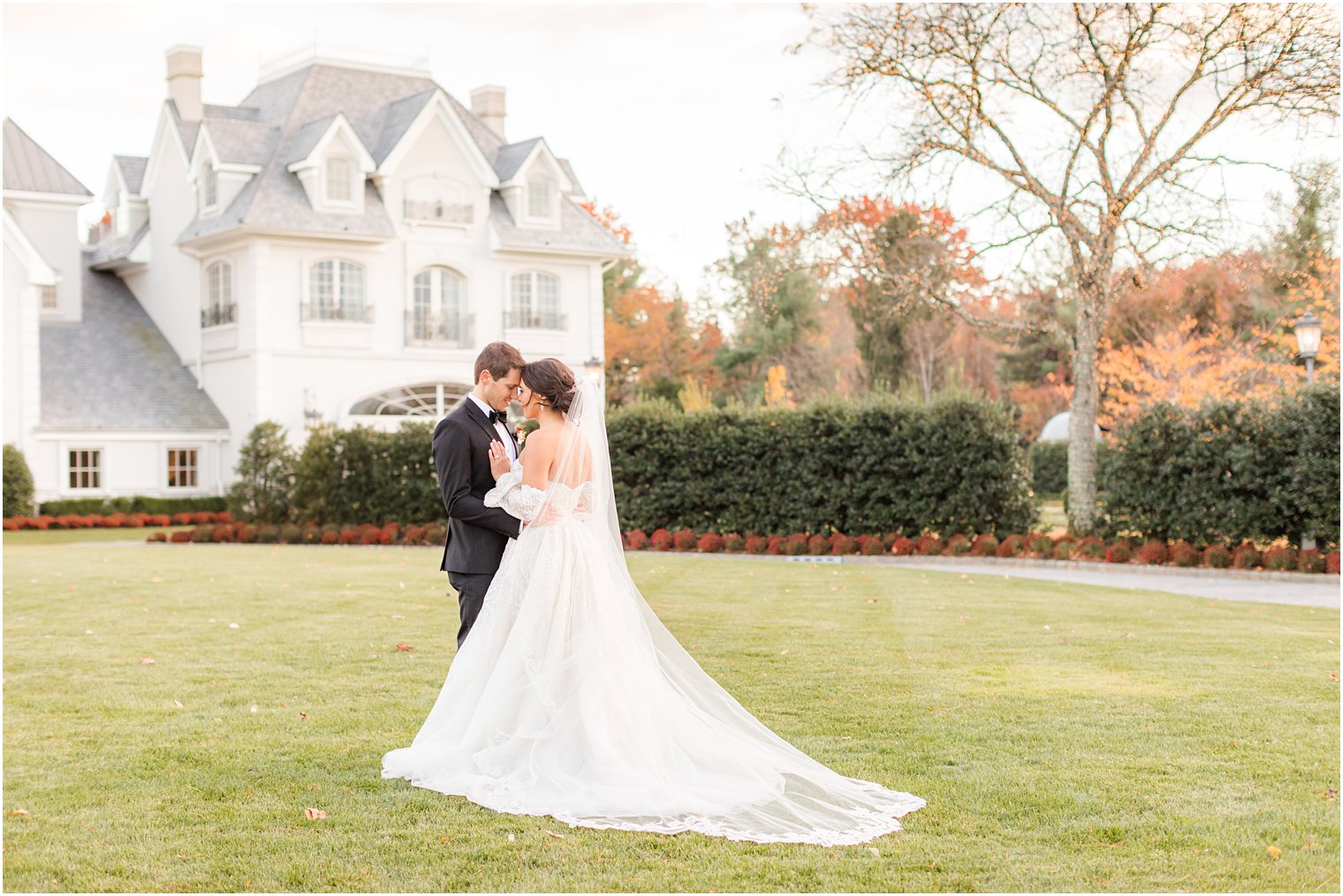 bride and groom stand together on lawn at Park Chateau Estate