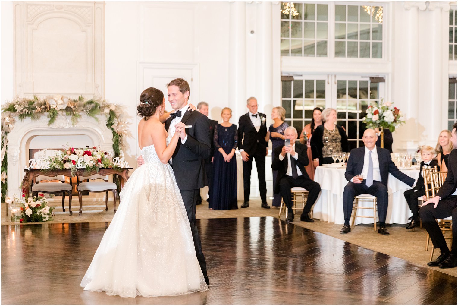 bride and groom dance together during Park Chateau Estate wedding reception 