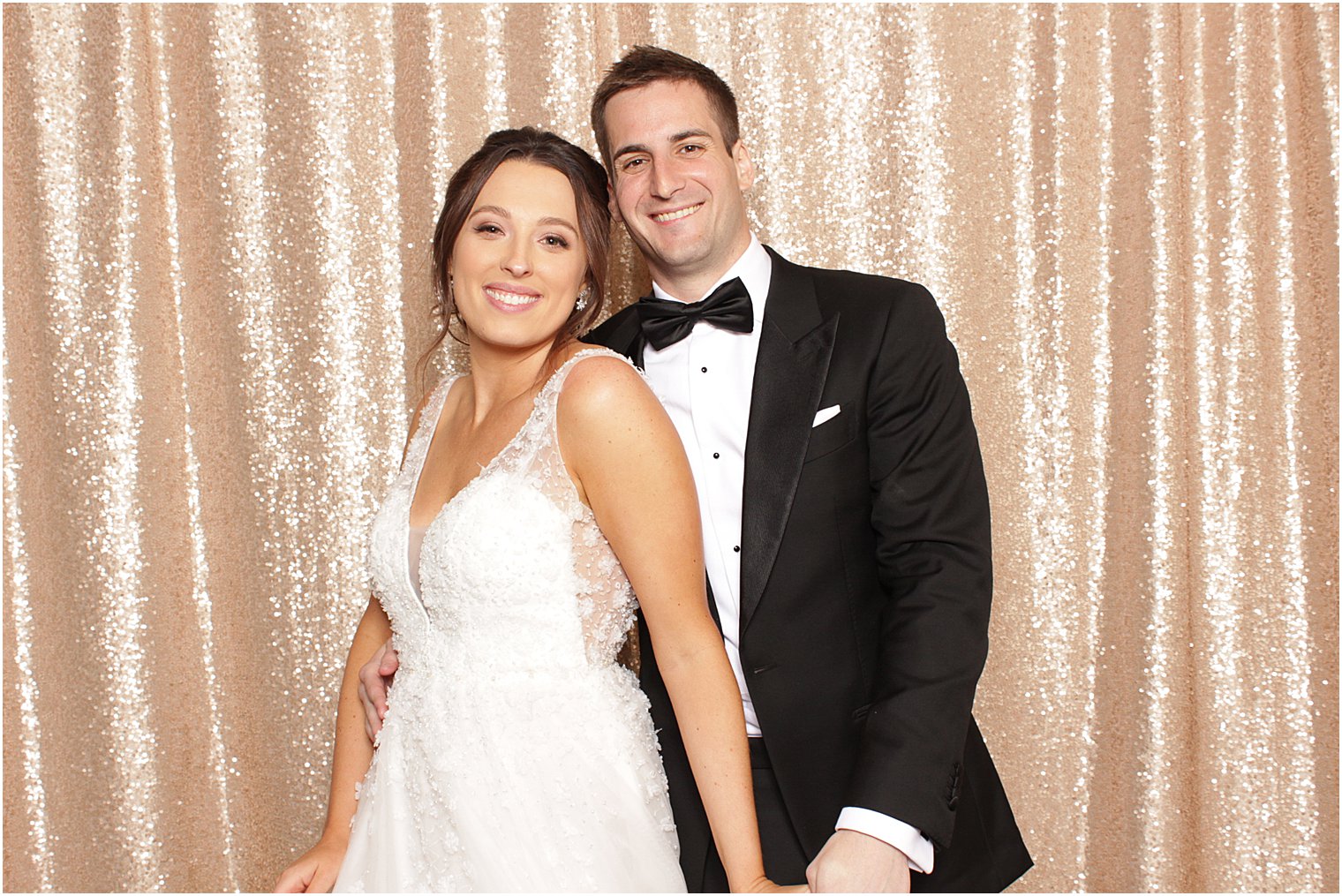 bride and groom pose together during photo booth at Indian Trail Club