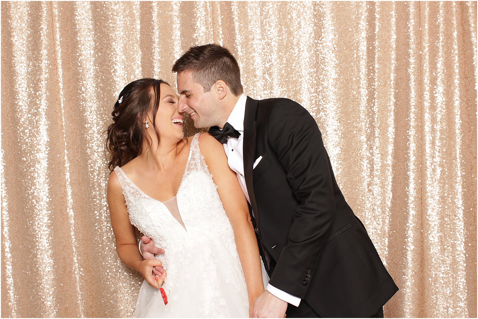 newlyweds kiss during Indian Trail Club photo booth