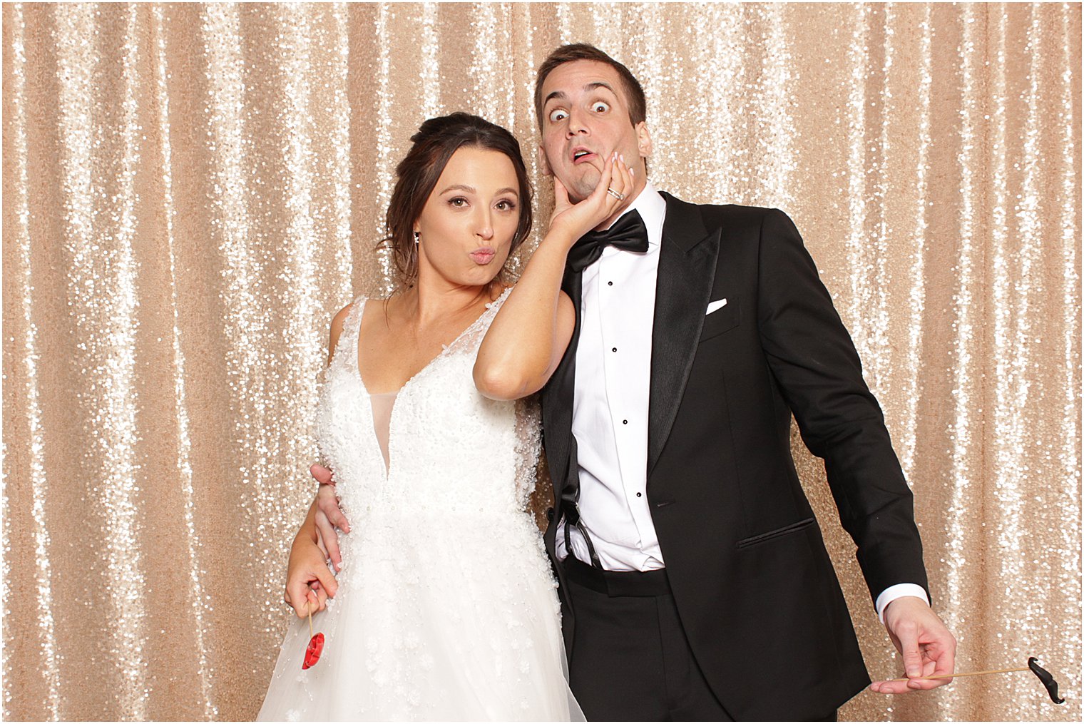 bride and groom play in Indian Trail Club photo booth