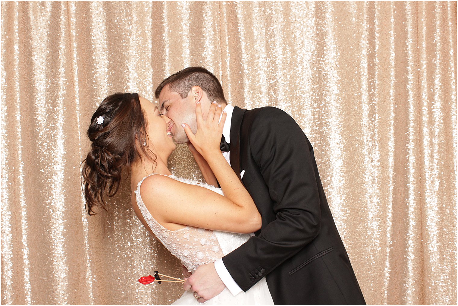 newlyweds kiss during Indian Trail Club photo booth