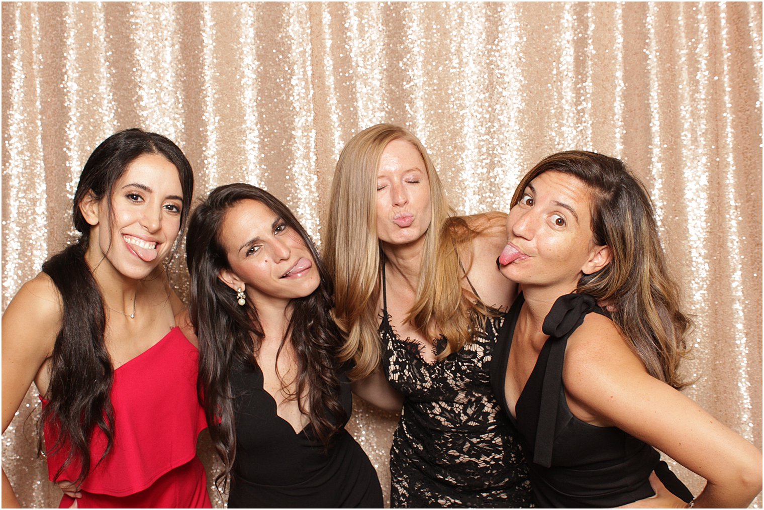 friends hug in photo booth during reception in NJ
