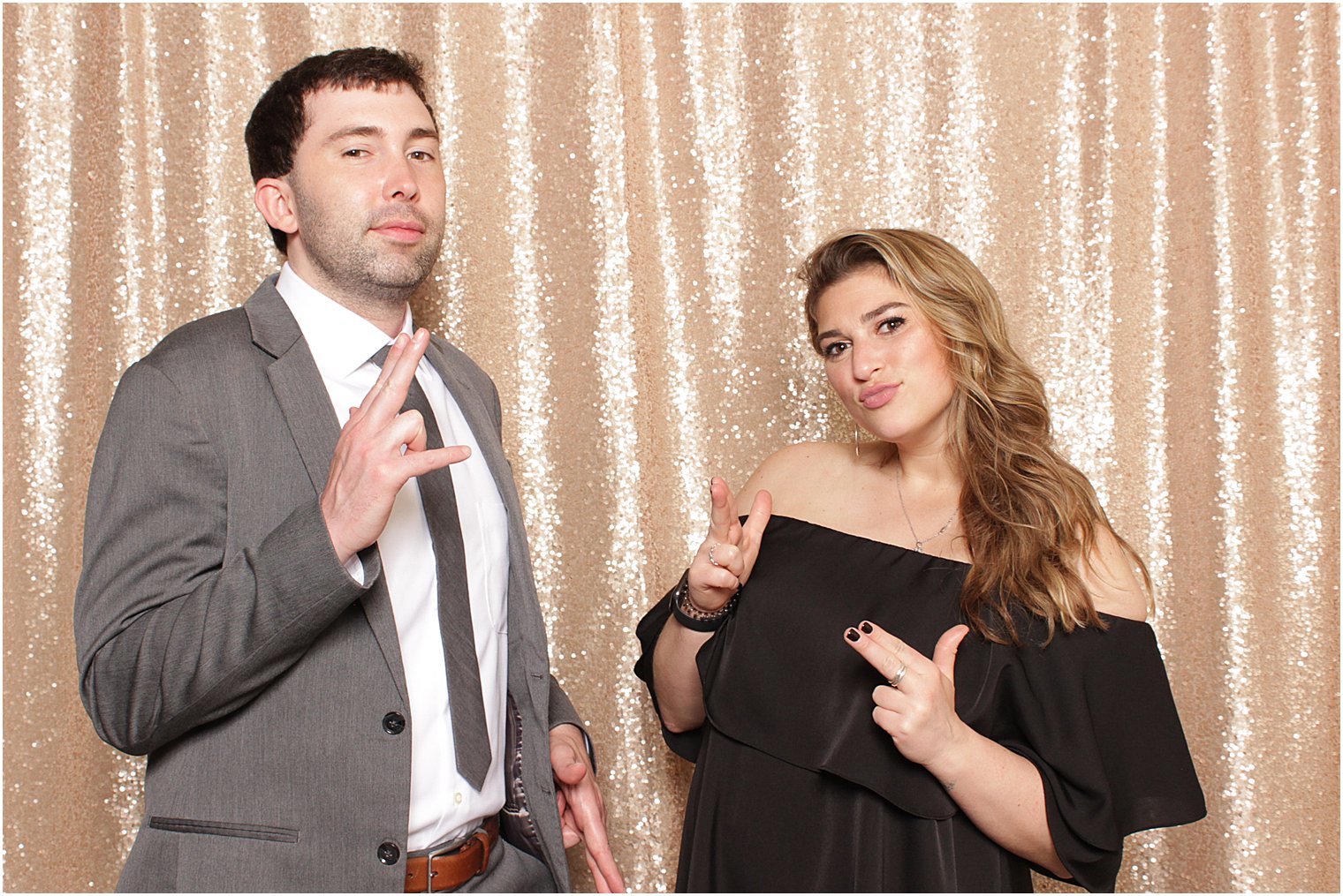 couple dances in photo booth at reception