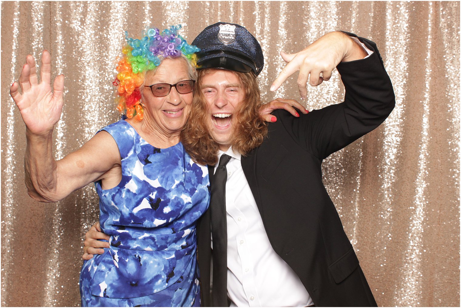 grandmother and grandson pose in photo booth