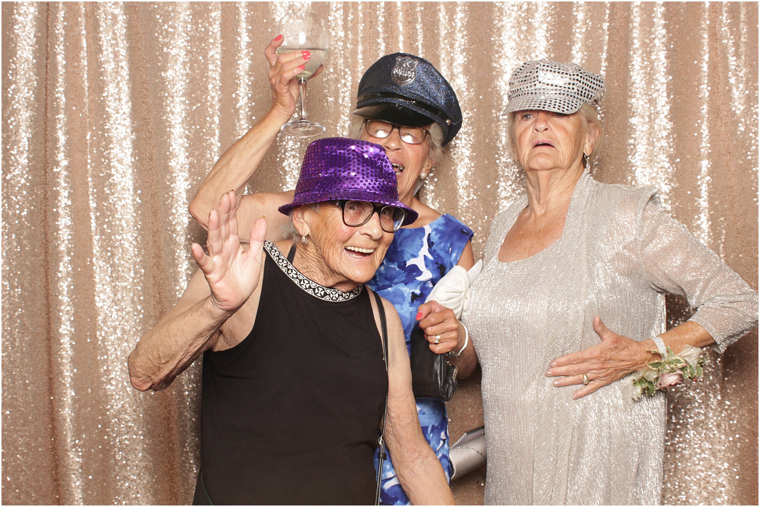 older women wear props during photo booth at Minerals Resort reception 