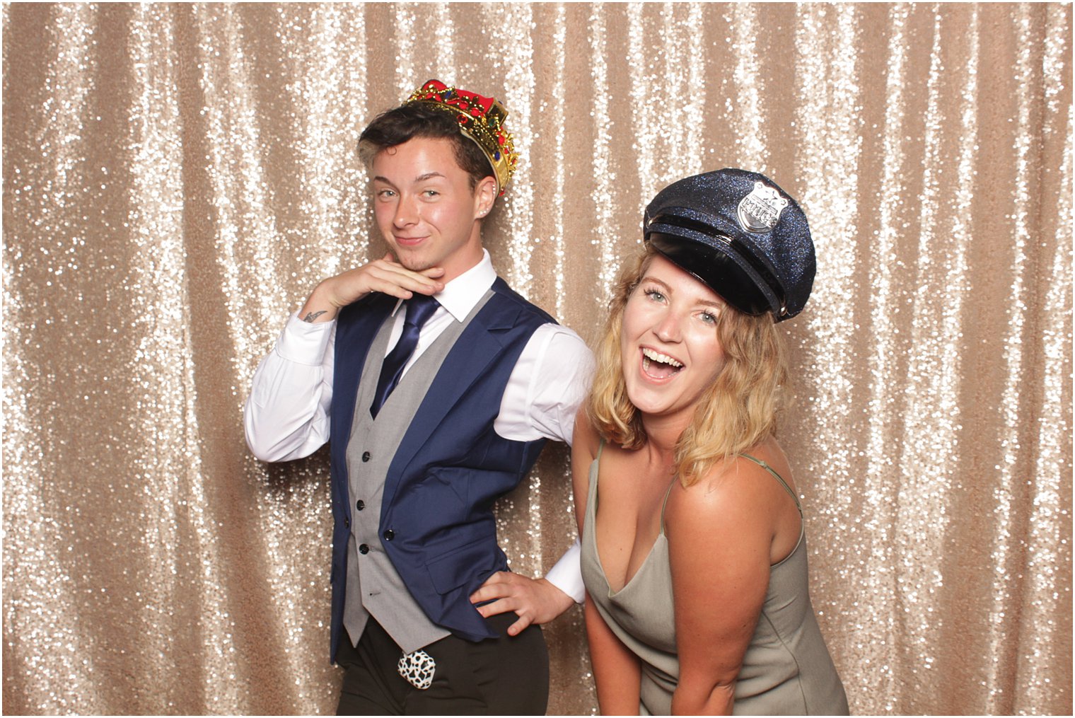 couple laughs together during photo booth