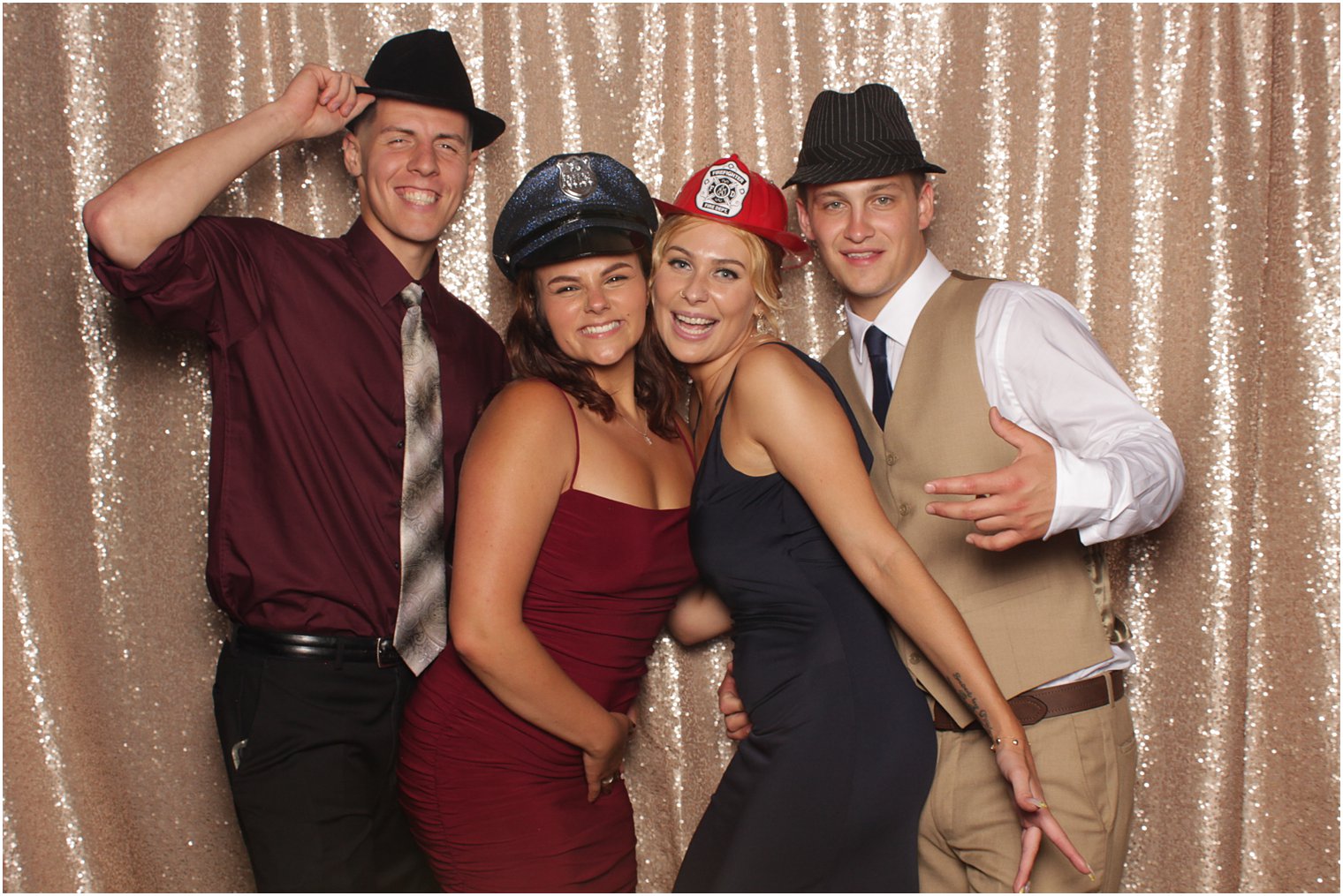 two couples stand together in photo booth in New Jersey