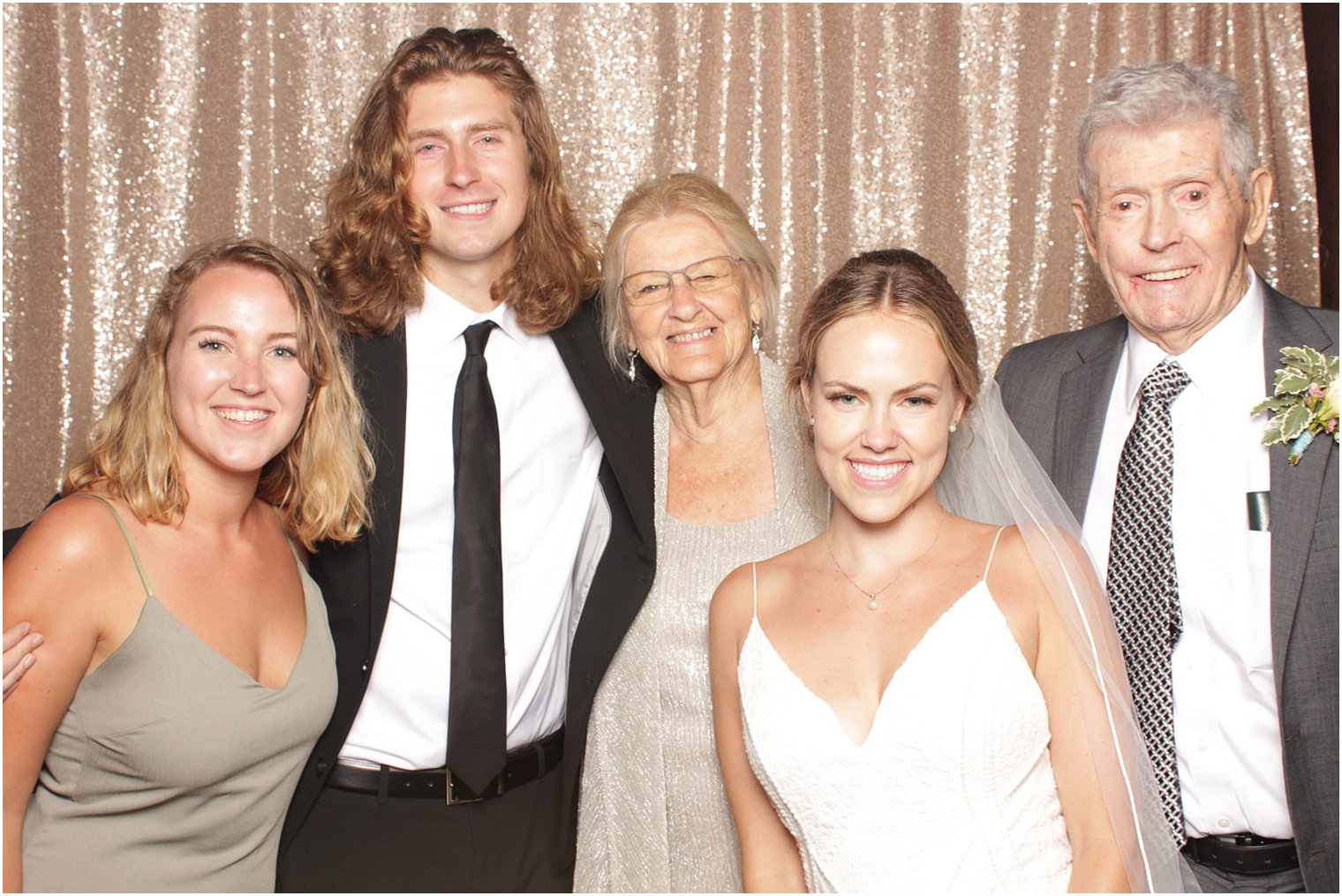 grandparents pose with grandkids during Minerals Resort photo booth