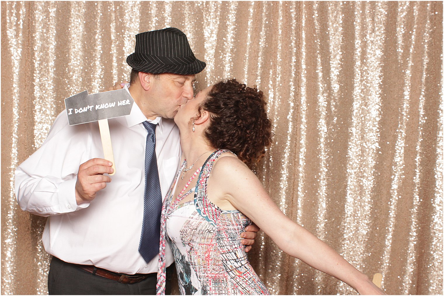 couple kisses in Photo booth during NJ wedding reception