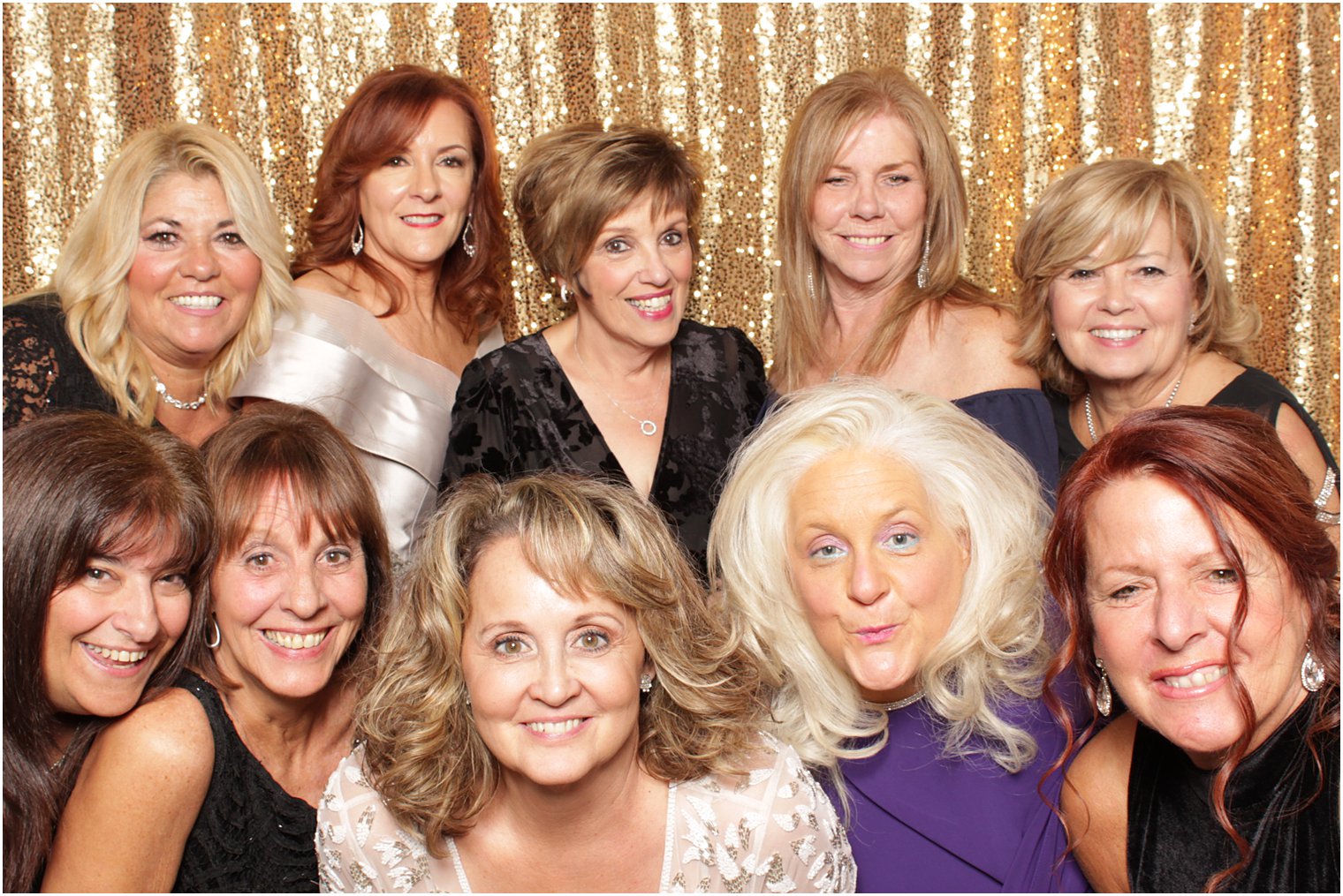 group poses in Valley Regency photo booth