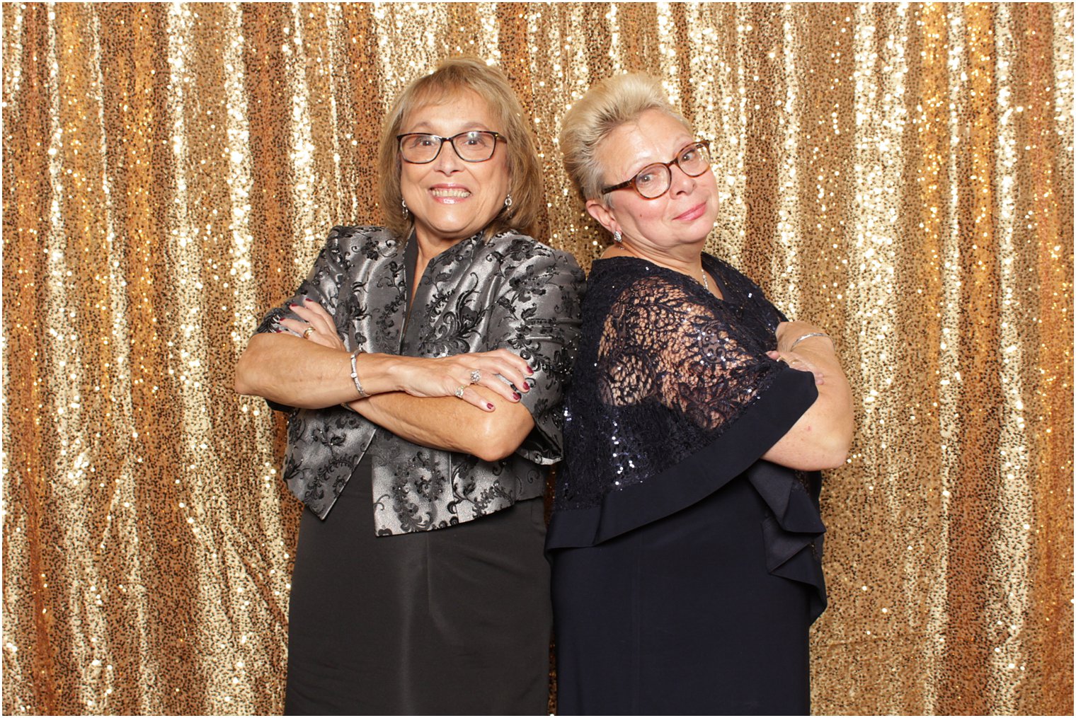 women stand back to back during Valley Regency photo booth