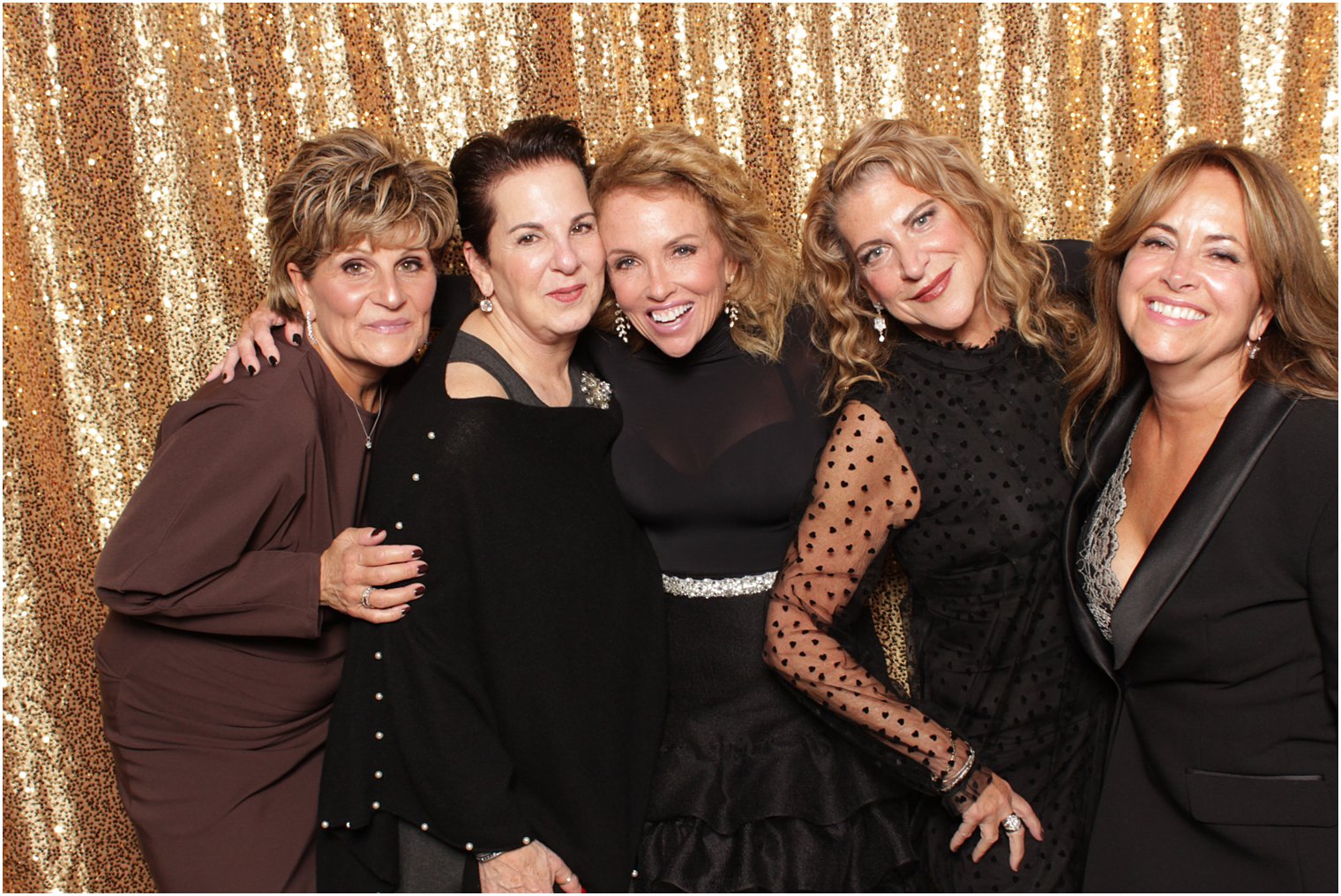 women pose together during Valley Regency photo booth