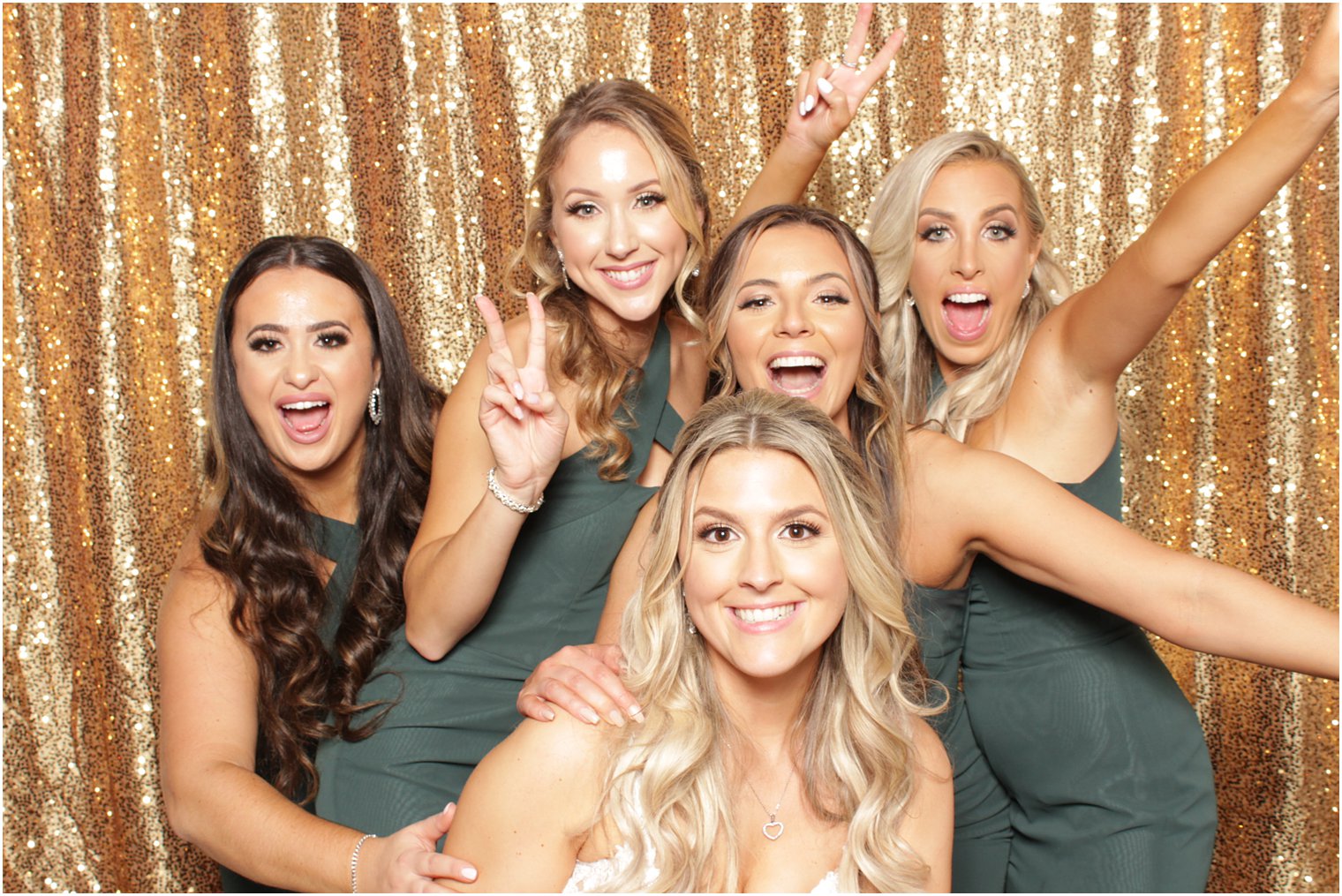 bride and bridesmaids pose during photo booth at NJ reception