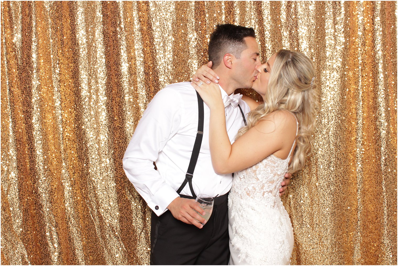 newlyweds kiss in Valley Regency photo booth