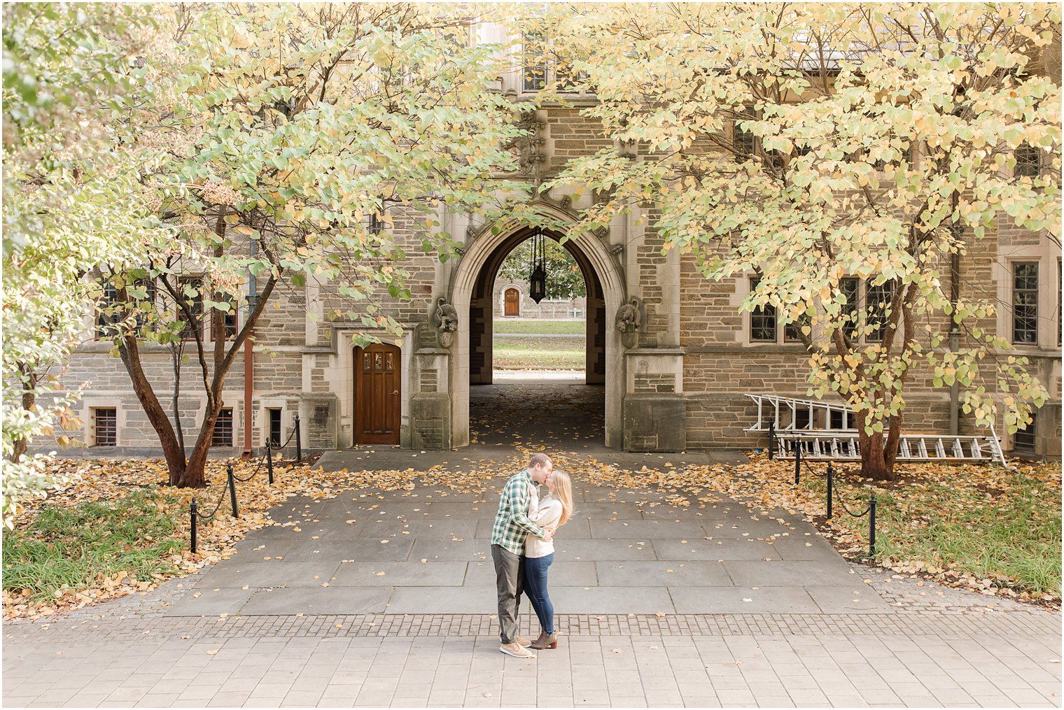 couple kisses during fall engagement photos at Princeton University