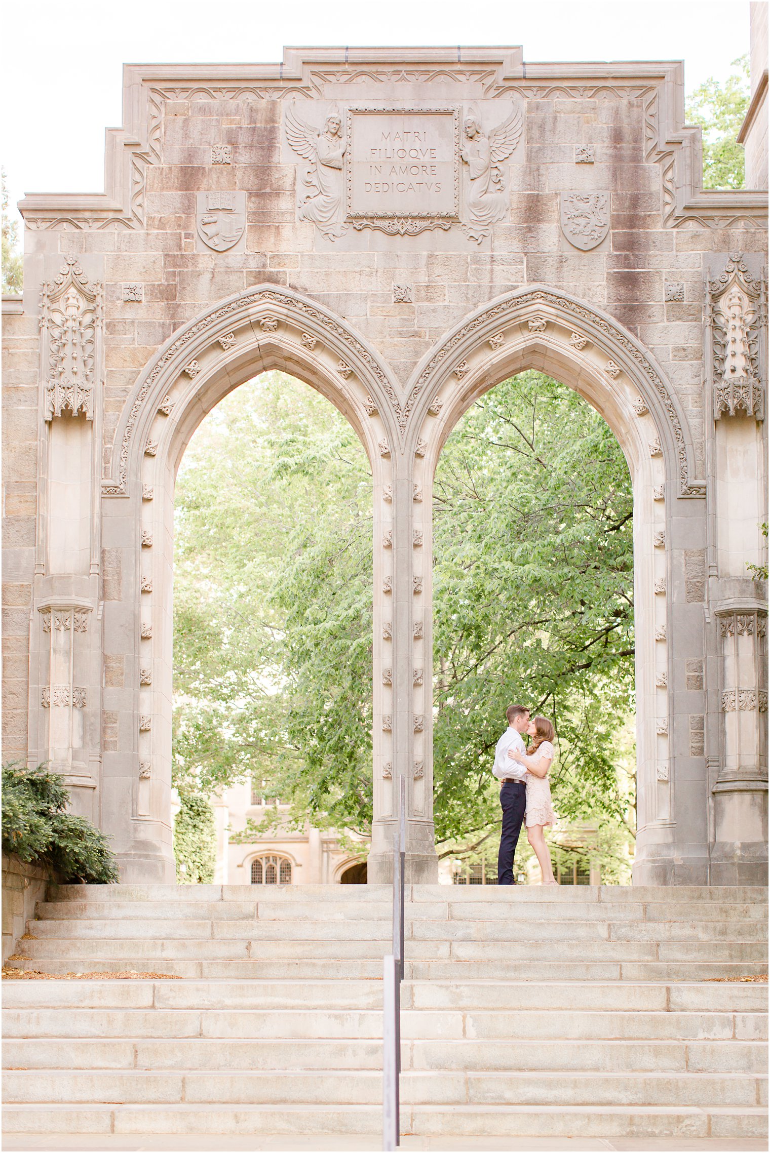 engaged couple poses near chapel of Princeton University 