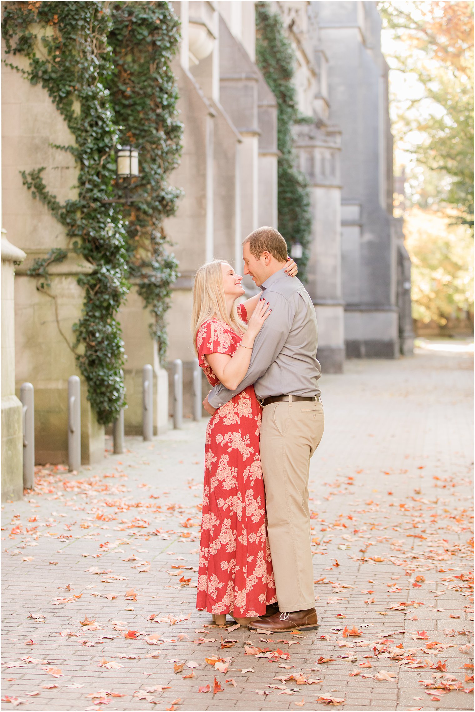 bride and groom hug during fall engagement photos at Princeton University