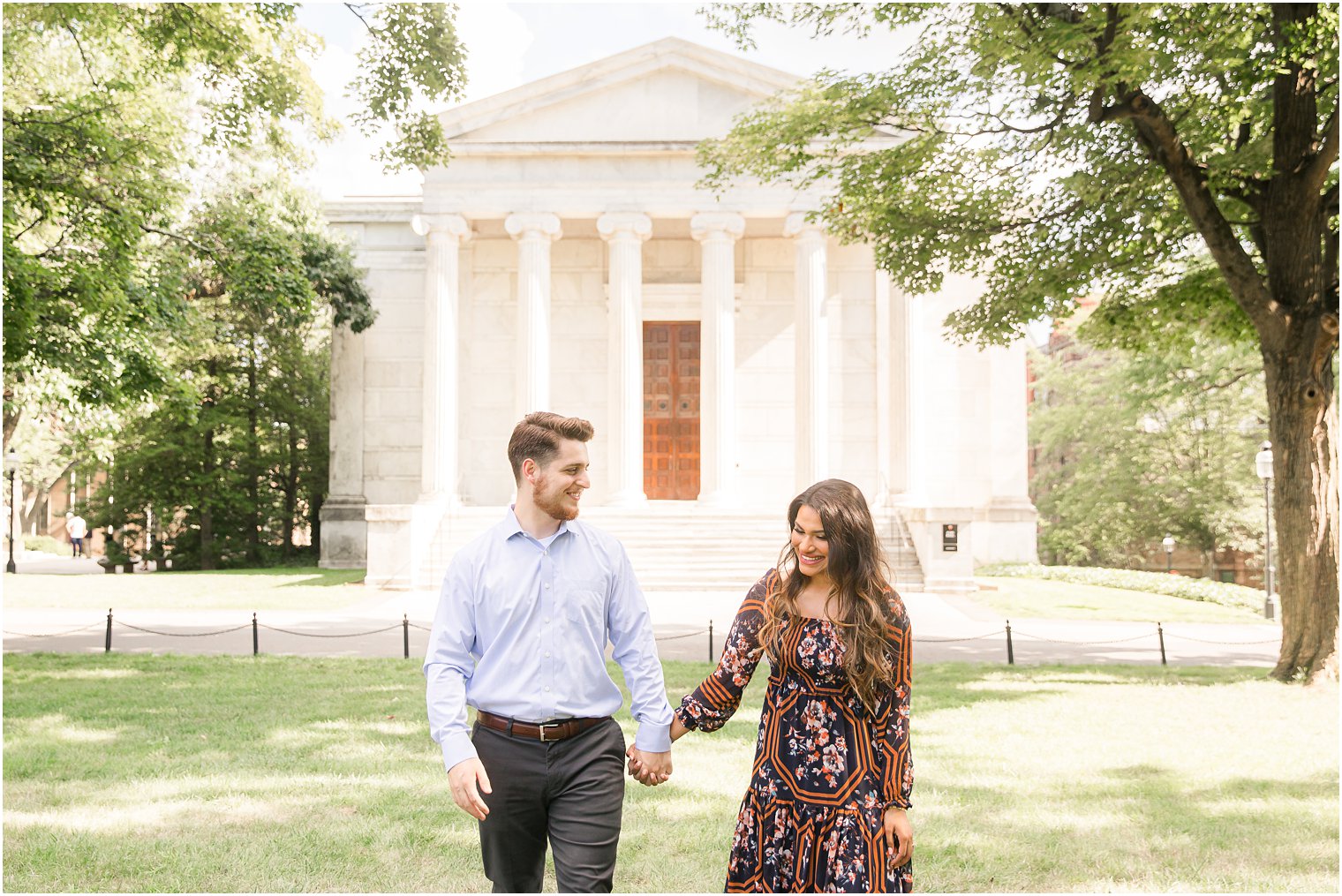 bride and groom hold hands walking on the lawn outside Chio and Whig at Princeton University