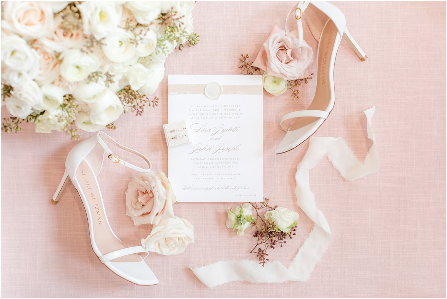 elegant invitation suite with white shoes for bride