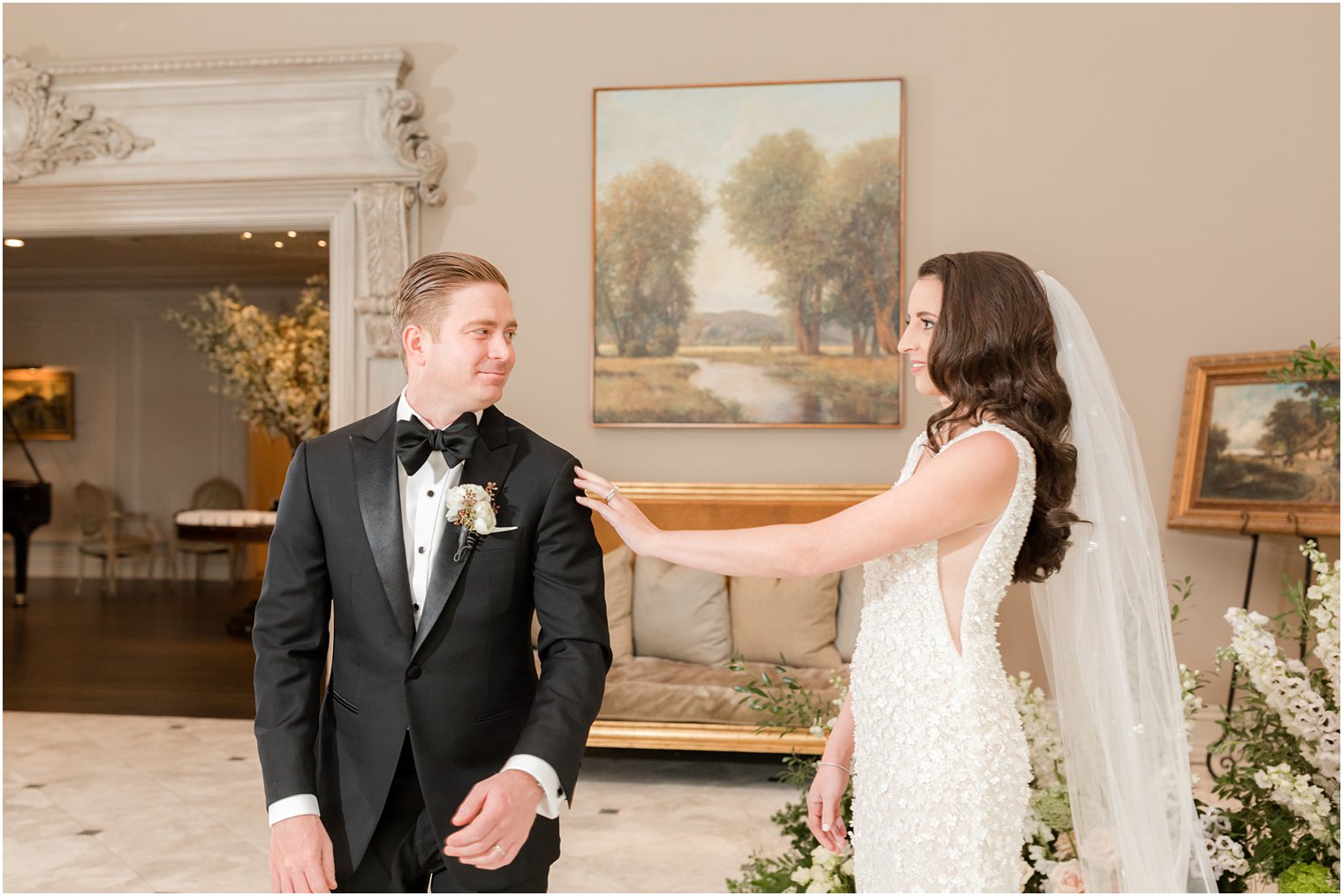 bride reaches for groom for first look at Park Chateau Estate 