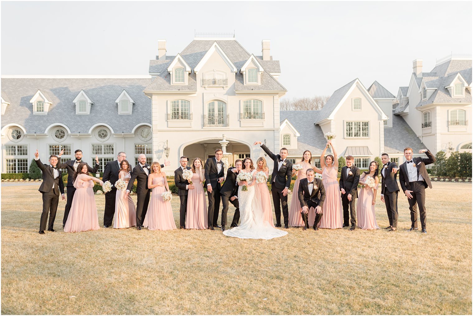 bridal party cheers during portraits in East Brunswick NJ 