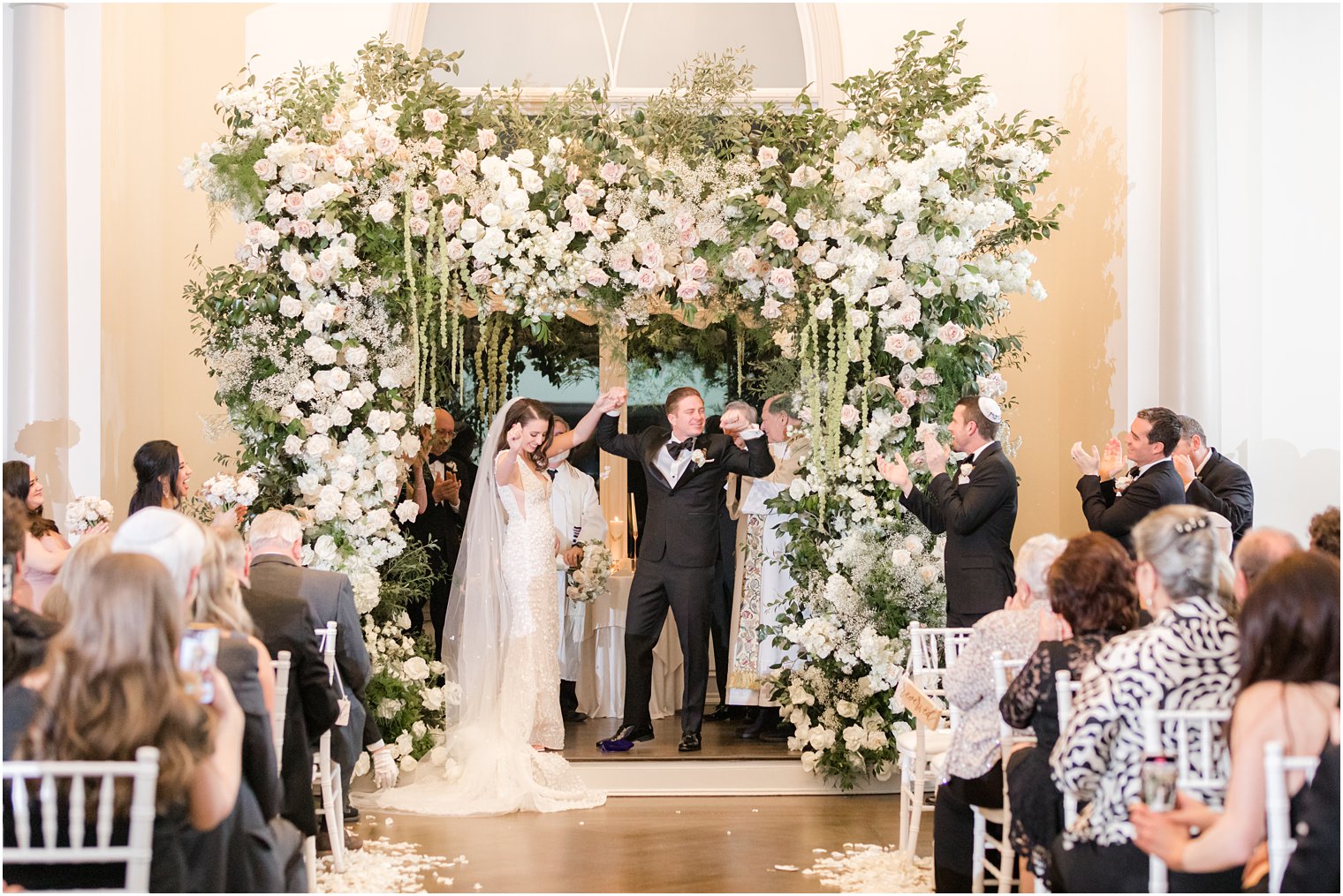 bride and groom cheer after Park Chateau winter wedding ceremony 