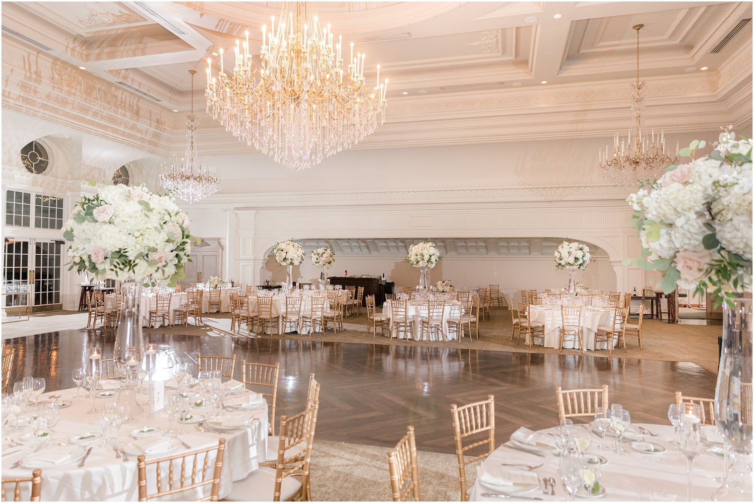 Park Chateau winter wedding reception with white and pink floral details 