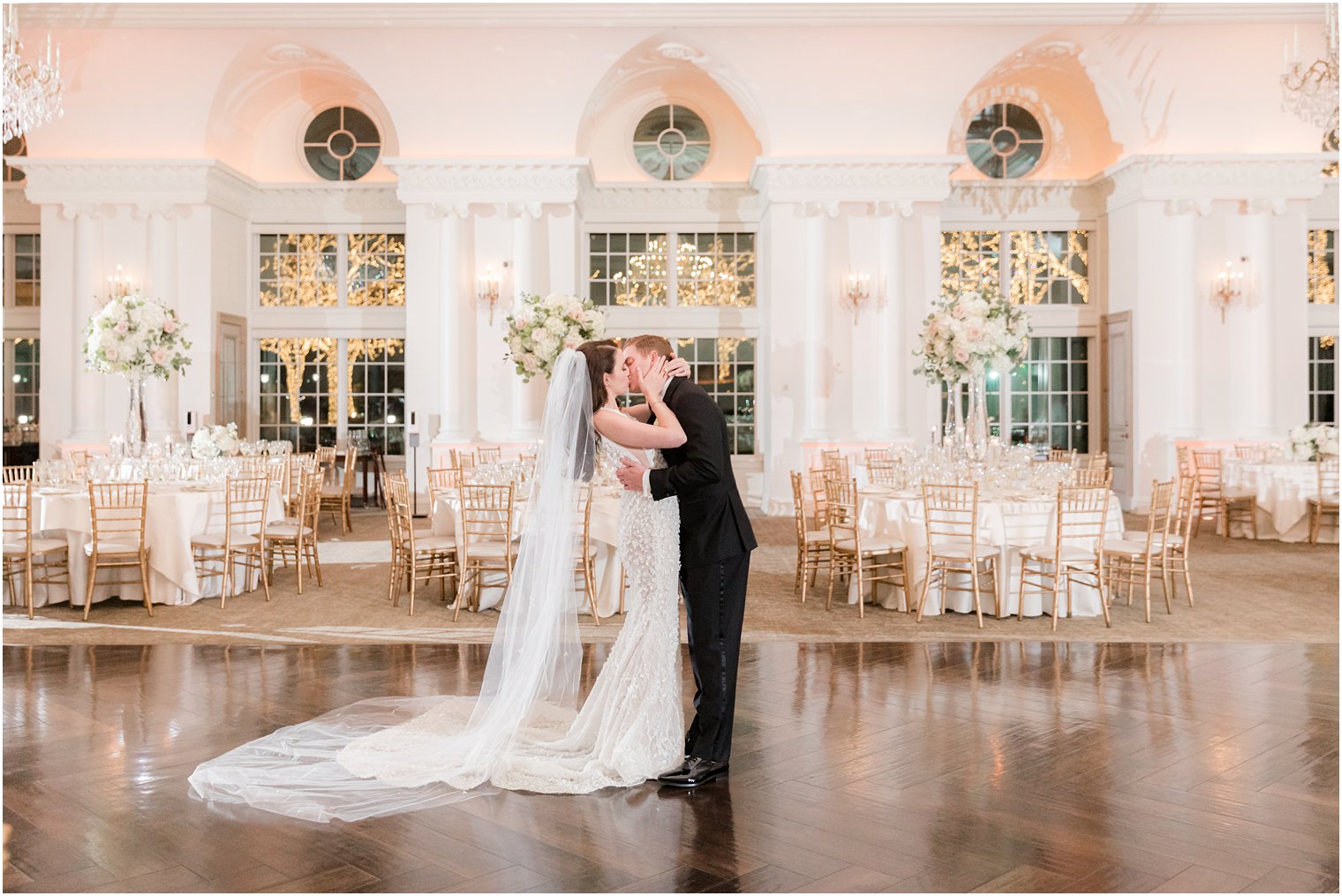 newlyweds kiss in reception room at Park Chateau 