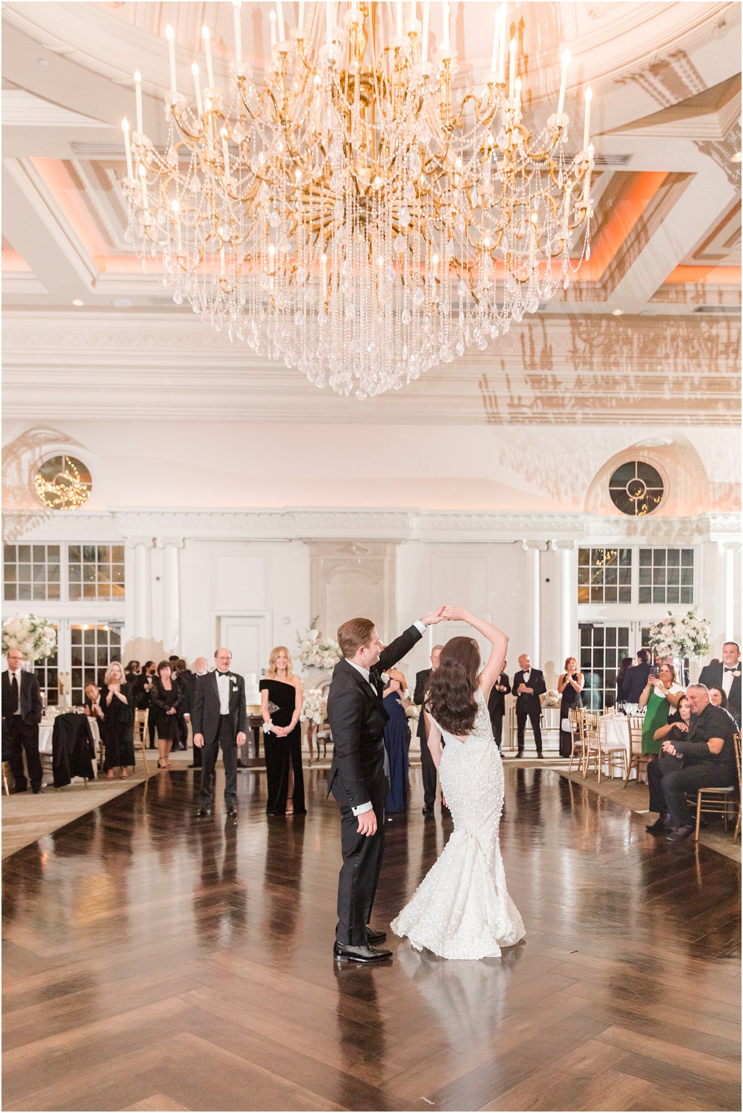 groom twirls bride during first dance in New Jersey 