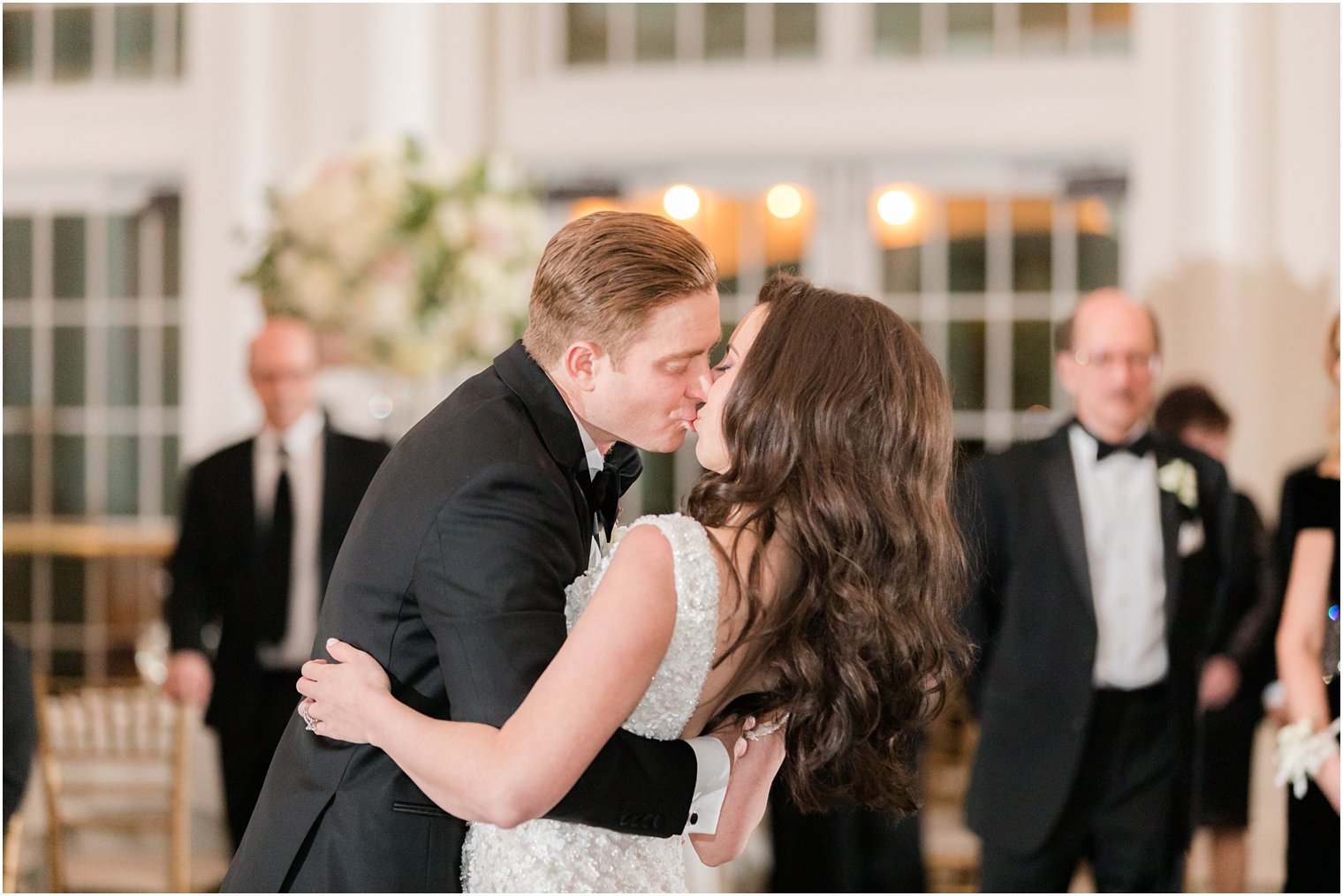 bride and groom kiss during first dance at East Brunswick NJ wedding reception 