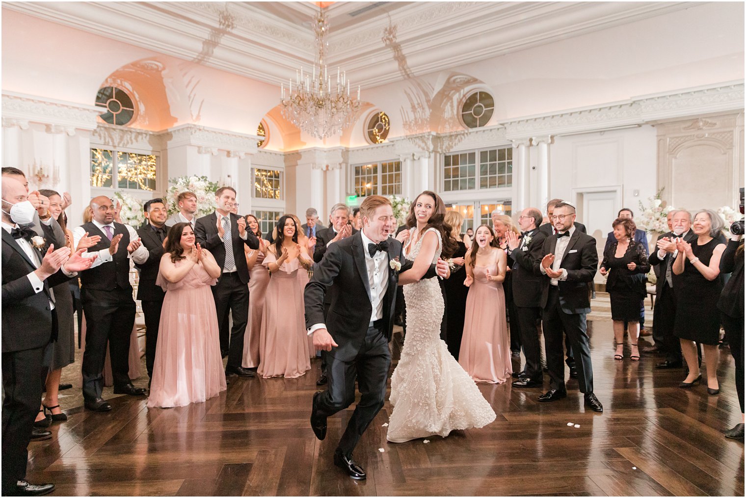 bride and groom twirl during East Brunswick NJ wedding reception dancing 