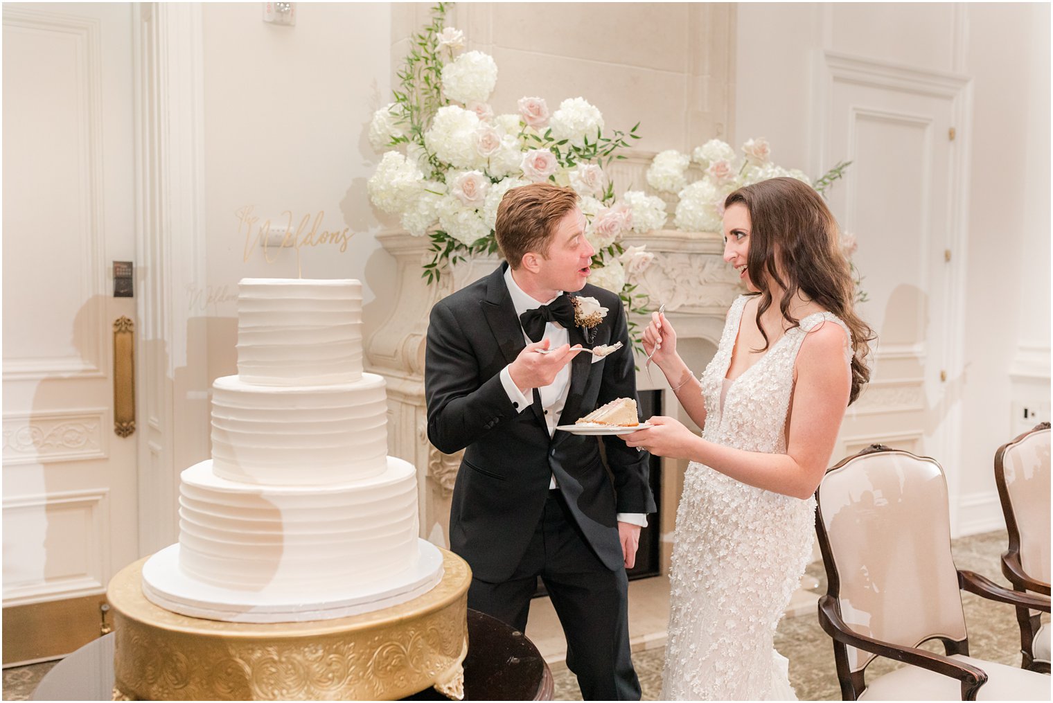 bride and groom cut wedding cake during East Brunswick NJ wedding reception 