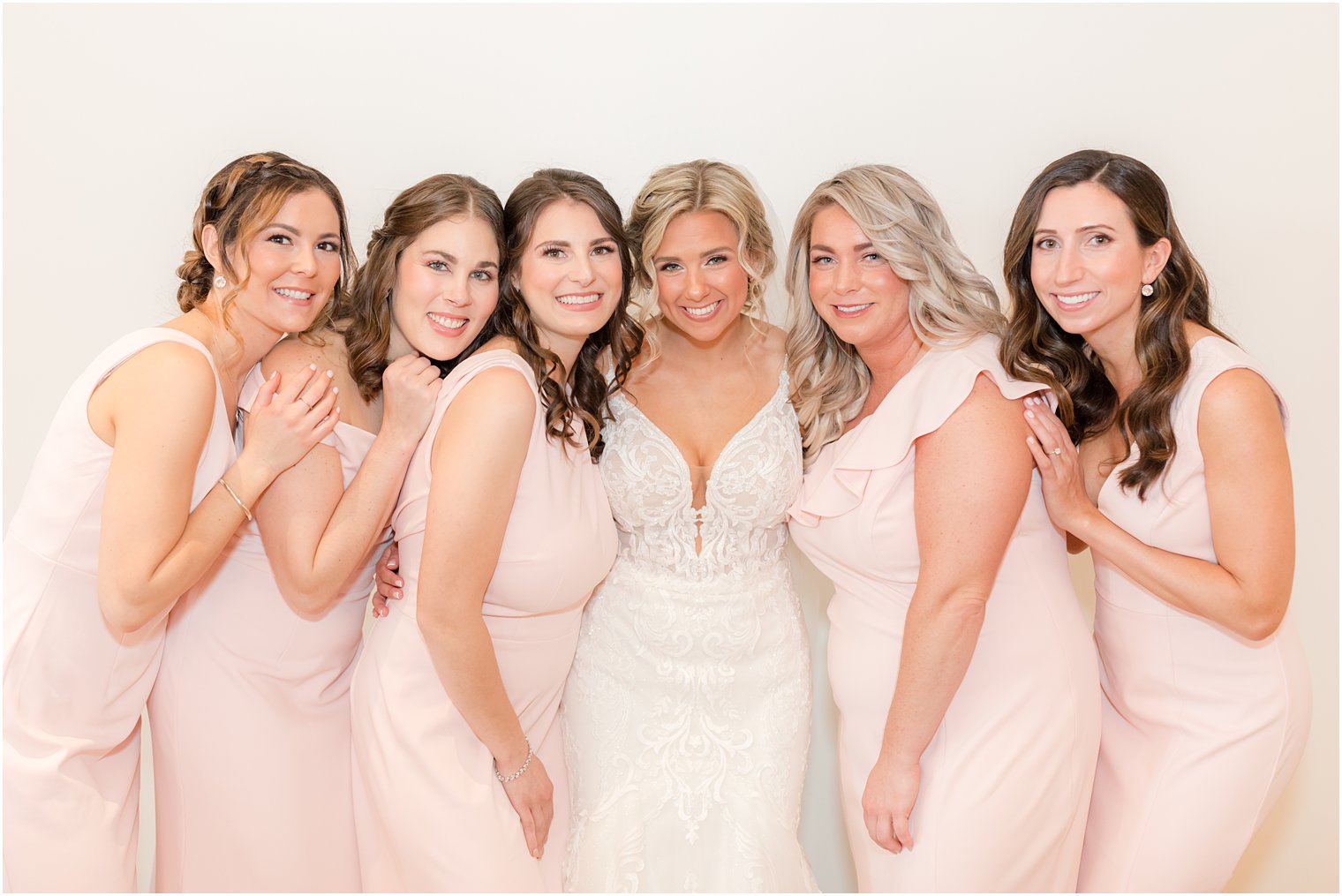 bride and bridesmaids group photo taken at Renault Winery in Egg Harbor Twp NJ