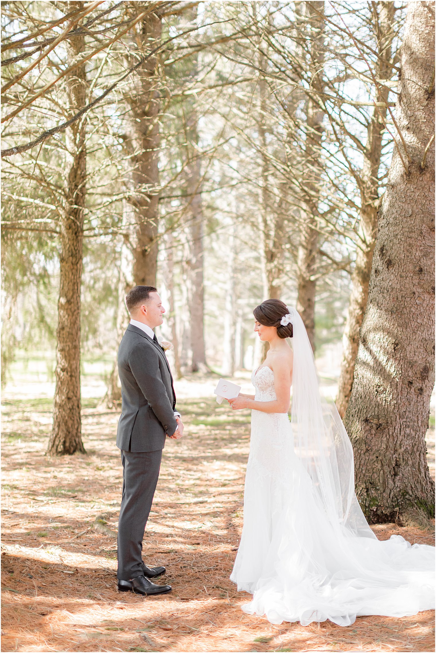 couple stands in woods at The Refinery at Perona Farms exchanging private vows